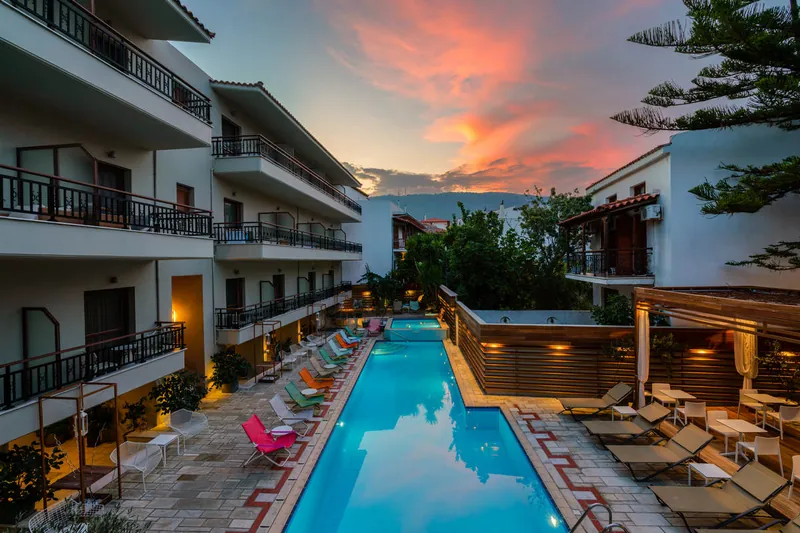 The pool under a pink sunset sky
